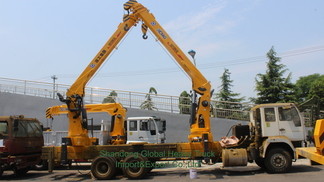 Nuevo 6X4 HOWO Camión de cama plana Grúa montada Camión telescópico